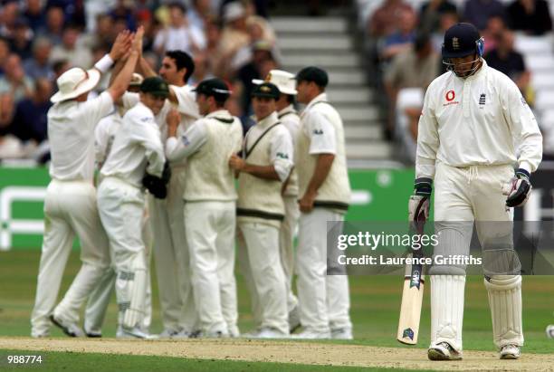 Dejected Marcus Trescothick of England as Jason Gillespie of Australia celebrates taking his wicket on the first day of the Npower Third Test Match...