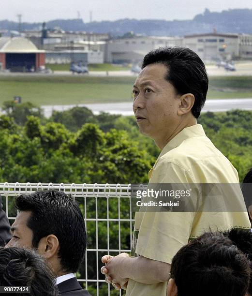 Japanese Prime Minister Yukio Hatoyama looks Futenma Airbase from Futenma Daini Elementary School on May 4, 2010 in Ginowan, Okinawa, Japan. Hatoyama...