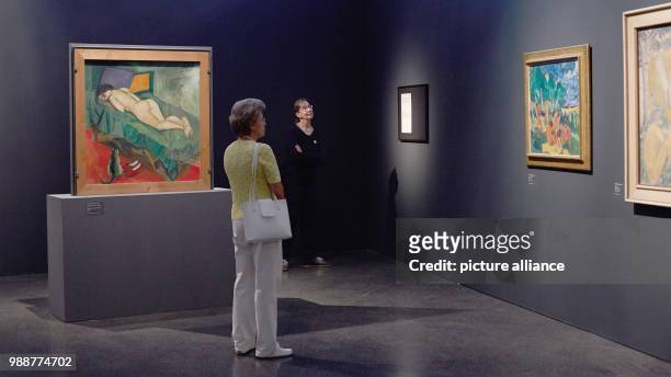 Visitors look at the exhibition 'The Savages of Germany. Die Bruecke and Der Blaue Reiter Expressionists' at the art museum Kumu in Tallinn, Estonia,...