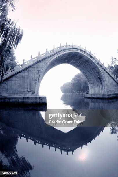 stone pedestrian bridge at summer palace - kunming lake stock pictures, royalty-free photos & images