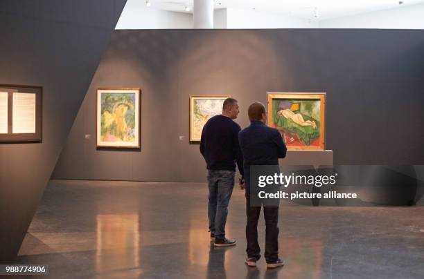 Visitors look at the exhibition 'The Savages of Germany. Die Bruecke and Der Blaue Reiter Expressionists' at the art museum Kumu in Tallinn, Estonia,...