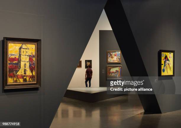 Visitors look at the exhibition 'The Savages of Germany. Die Bruecke and Der Blaue Reiter Expressionists' at the art museum Kumu in Tallinn, Estonia,...