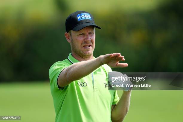 Mikko Ilonen of Finland prepares to play his second shot on the 1st hole during day four of the HNA Open de France at Le Golf National on July 1,...