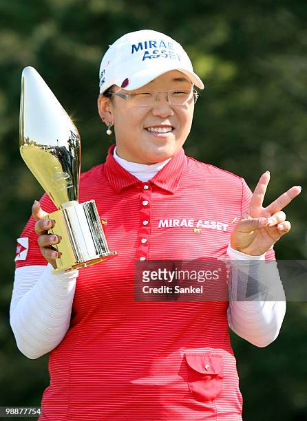Shin Jiyai of South Korea poses with the trophy after winning the CyberAgent Ladies Golf Tournament at Tsurumai Country Club on May 2, 2010 in...