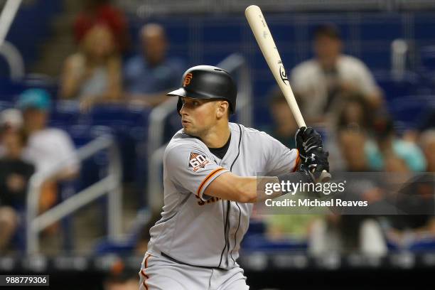 Joe Panik of the San Francisco Giants in action against the Miami Marlins at Marlins Park on June 14, 2018 in Miami, Florida.