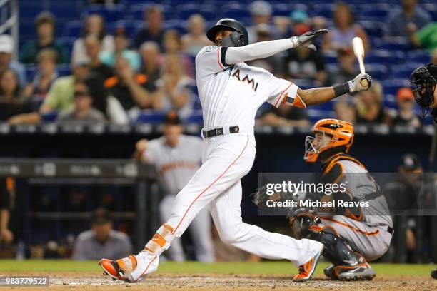 Lewis Brinson of the Miami Marlins in action against the San Francisco Giants at Marlins Park on June 14, 2018 in Miami, Florida.