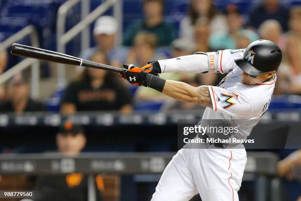 Derek Dietrich of the Miami Marlins in action against the San Francisco Giants at Marlins Park on June 14, 2018 in Miami, Florida.