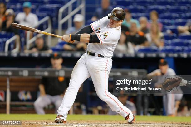 Justin Bour of the Miami Marlins in action against the San Francisco Giants at Marlins Park on June 14, 2018 in Miami, Florida.