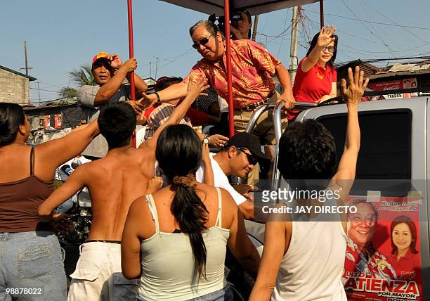 By Jason Gutierrez In a file picture taken on April 5, 2010 former Manila mayor Lito Atienza shakes hands with residents in a motorcade beside a...