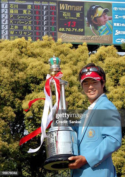 Ryo Ishikawa of Japan poses for photographs with the trophy after winning The 51st Chunichi Crowns at Nagoya Golf Club on April 29, 2010 in Togo,...