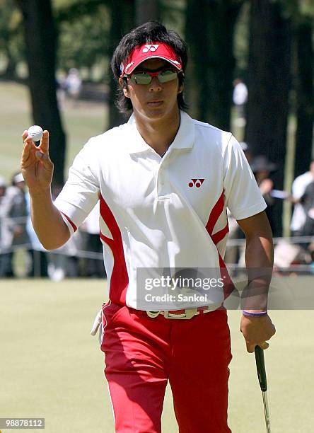 Ryo Ishikawa of Japan waves to the fans after holing the birdie putt on the 5th green during the final round of The 51st Chunichi Crowns at Nagoya...