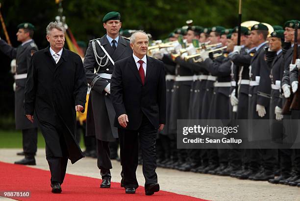 German President Horst Koehler and Kosovo President Fatmir Sejdiu review a guard of honour upon Sejdiu's arrival at Bellevue Palace on May 6, 2010 in...