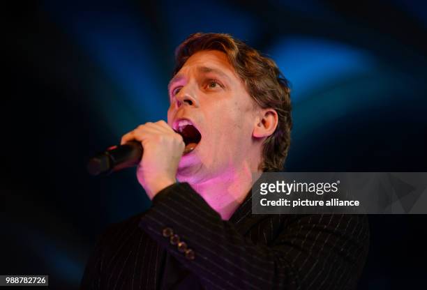 Musical performer David Jakobs as the hunchbacked bell ringer Quasimodo singing during a press preview in the Castle Church of the Old Castle in...