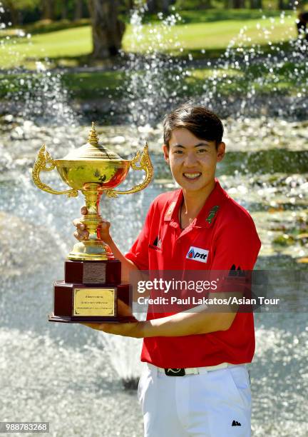 Jazz Janewattananond of Thailand pictured with the Queen's Cup winner's trophy after the final round of the Queen's Cup Presented By Bangchak at...