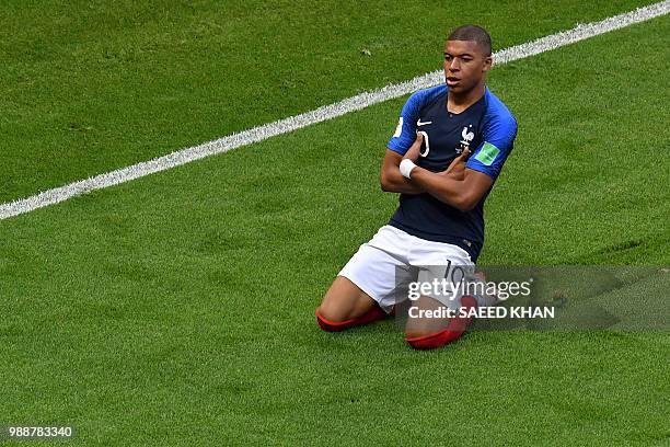 France's Kylian Mbappe celebrates after scoring his team's third goal during the Russia 2018 World Cup round of 16 football match between France and...