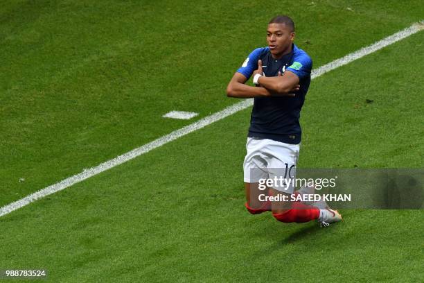 France's Kylian Mbappe celebrates after scoring his team's third goal during the Russia 2018 World Cup round of 16 football match between France and...