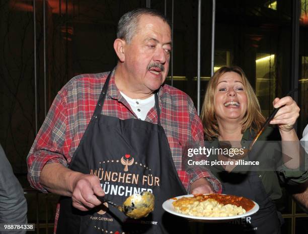 Actors Joseph Hannesschlager and Karin Thaler, known from the ZDF series "Die Rosenheim-Cops" , supporting the Munchner Tafel e.V. During the...