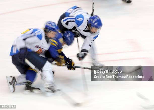 Motion blur action during the ice hockey women's bronze medal game between Finland and Sweden on day 14 of the Vancouver 2010 Winter Olympics at...