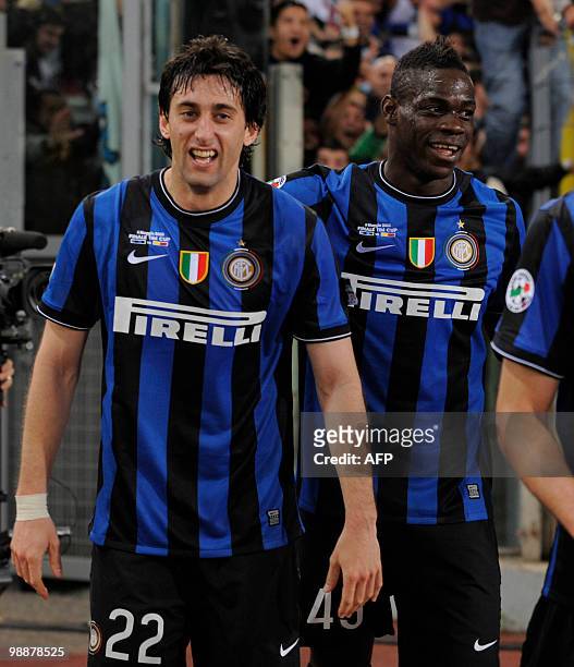 Inter Milan's Argentinian forward Alberto Milito Diego celebrates with team mate forward Mario Balotelli after scoring against AS Roma during the...
