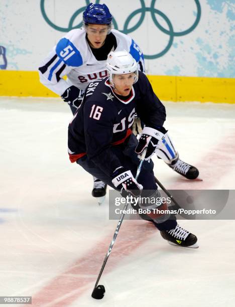 Joe Pavelski of the USA with Valtteri Filppula of Finland during the ice hockey men's semifinal game between the United States and Finland on day 15...