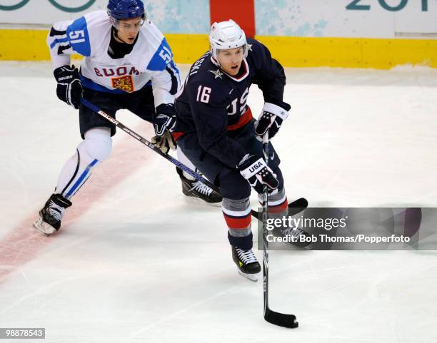 Joe Pavelski of the USA with Valtteri Filppula of Finland during the ice hockey men's semifinal game between the United States and Finland on day 15...