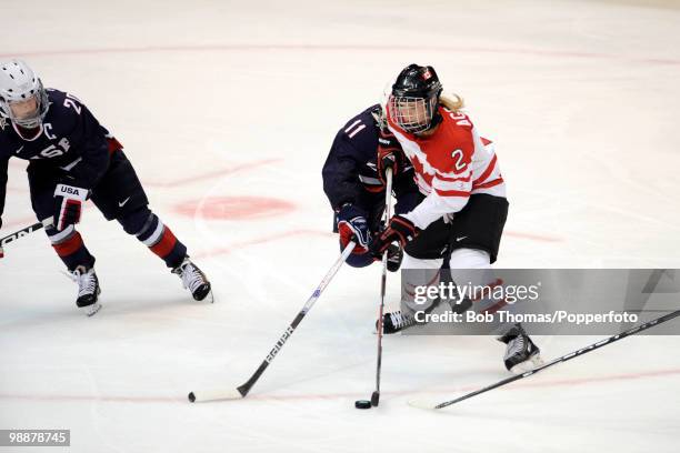 Meghan Agosta of Canada with Lisa Chesson of the USA during the ice hockey women's gold medal game between Canada and the USA on day 14 of the...