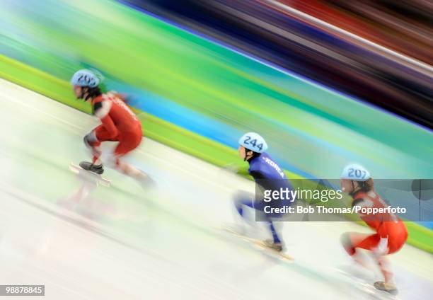 Motion blur action during the Men's 500m Short Track Speed Skating on day 15 of the 2010 Vancouver Winter Olympics at Pacific Coliseum on February...