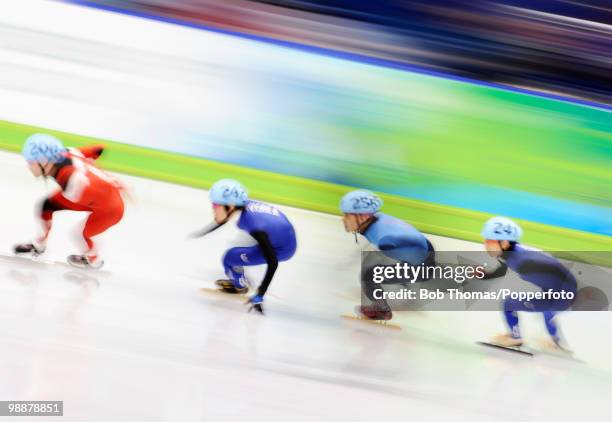 Motion blur action during the Men's 500m Short Track Speed Skating on day 15 of the 2010 Vancouver Winter Olympics at Pacific Coliseum on February...