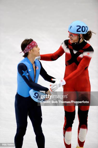 Relay Gold medalist Jean Oliver of Canada shakes hands with bronze medalist Apolo Anton Ohno of the USA after the Men's 5000m Relay Short Track Speed...