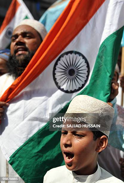 An Indian Muslim child shouts anti-Pakistani slogans during a rally celebrating the sentencing of Mohammed Ajmal Amir Kasab in Mumbai on May 6, 2010....