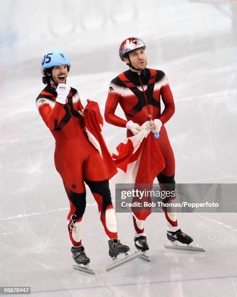 Gold medalist Charles Hamelin of Canada celebrates with bronze medalist Francois-Louis Tremblay of Canada in the Men's 500m Short Track Speed Skating...