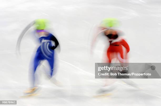 Motion blur action during the Ladies' 1000m Short Track Speed Skating on day 15 of the 2010 Vancouver Winter Olympics at Pacific Coliseum on February...