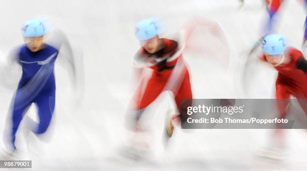 Motion blur action during the Men's 500m Short Track Speed Skating on day 15 of the 2010 Vancouver Winter Olympics at Pacific Coliseum on February...