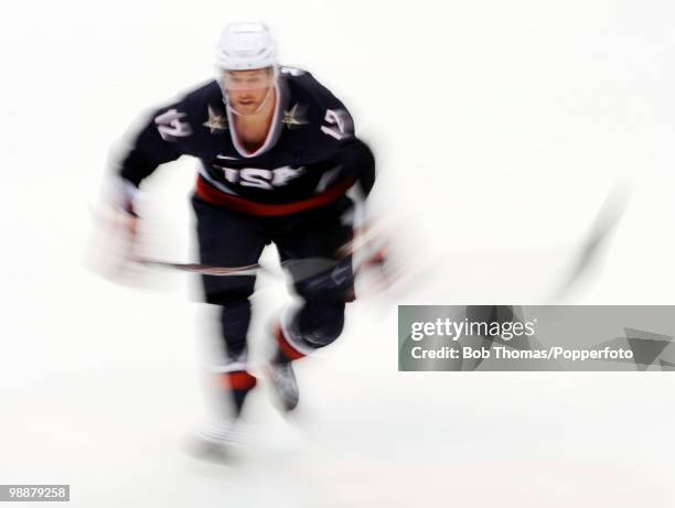 Motion blur action during the ice hockey men's preliminary game between the USA and Switzerland on day 5 of the Vancouver 2010 Winter Olympics at...