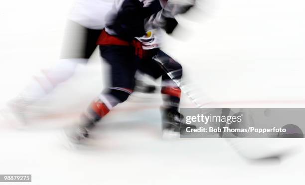 Motion blur action during the ice hockey men's preliminary game between the USA and Switzerland on day 5 of the Vancouver 2010 Winter Olympics at...