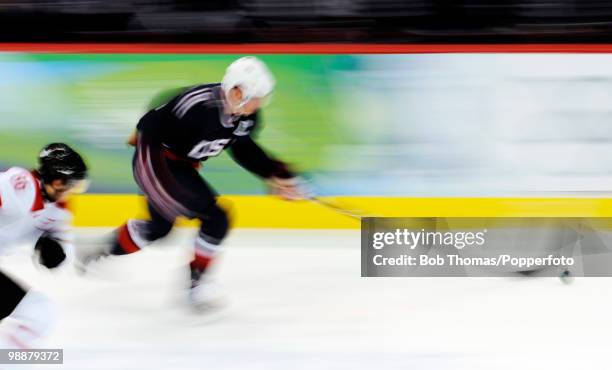 Motion blur action during the ice hockey men's preliminary game between the USA and Switzerland on day 5 of the Vancouver 2010 Winter Olympics at...