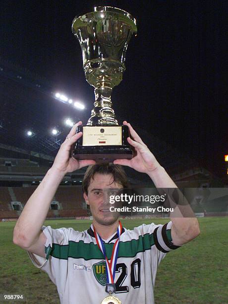 Davleton Fevzi, the Captain of Uzbekistan lifts aloft the Merdeka Trophy after his Team defeated Bosnia & Herzegovina in a golden goal during extra...