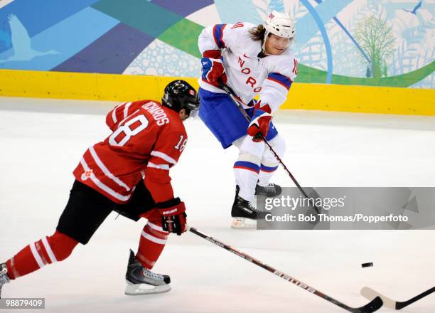 Lars Erik Spets of Norway with Mike Richards of Canada during the Canada v Norway ice hockey men's preliminary game on day 5 of the Vancouver 2010...