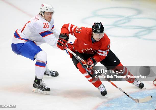 Rick Nash of Canada with Kristian Forsberg of Norway during the Canada v Norway ice hockey men's preliminary game on day 5 of the Vancouver 2010...