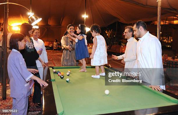 Hold for EAME ++ Saudi Prince Alwaleed bin Talal, right, his wife Princess Amira Al-Taweel, third from right, play with the Prince's grandchildren,...