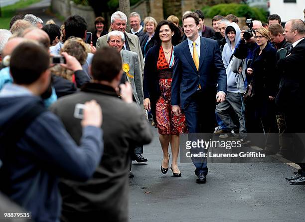 Liberal Democrat leader, Nick Clegg walks through a crowd on his way to casting his vote with wife Miriam Gonzalez Durantez at Bents Green Methodist...