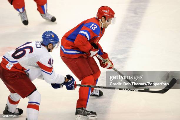 Pavel Datsyuk of Russia with David Krejci of the Czech Republic during the ice hockey men's preliminary game between Russia and the Czech Republic on...