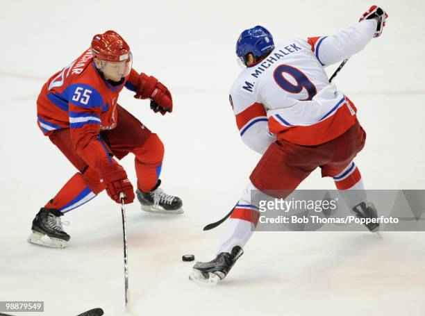 Sergei Gonchar of Russia with Milan Michalek of the Czech Republic during the ice hockey men's preliminary game between Russia and the Czech Republic...