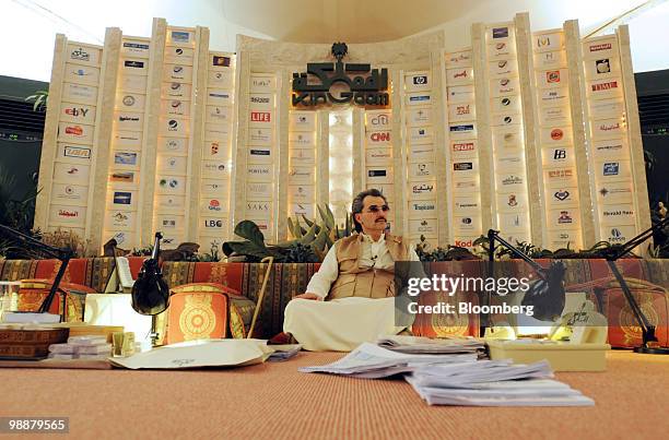 Saudi Prince Alwaleed bin Talal, looks at paperwork at the desert camp near Riyadh, Saudi Arabia, on Wednesday, April 28, 2010. Alwaleed said he will...