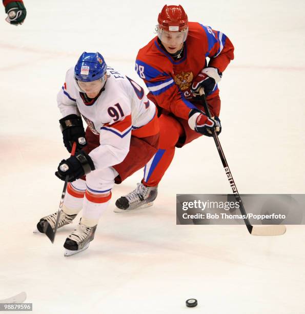 Martin Erat of the Czech Republic with Alexander Semin of Russia during the ice hockey men's preliminary game between Russia and the Czech Republic...