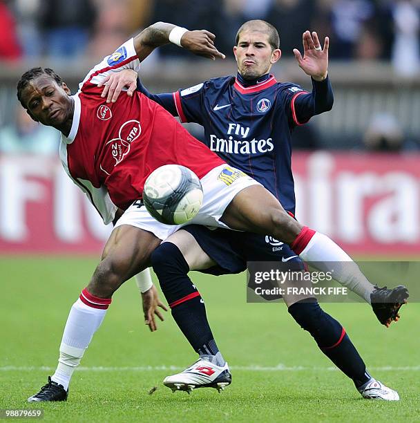 Paris Saint-Germain's defender Christophe Jallet vies with Valenciennes' forward Gaetan Bong during their French L1 football match Paris vs...