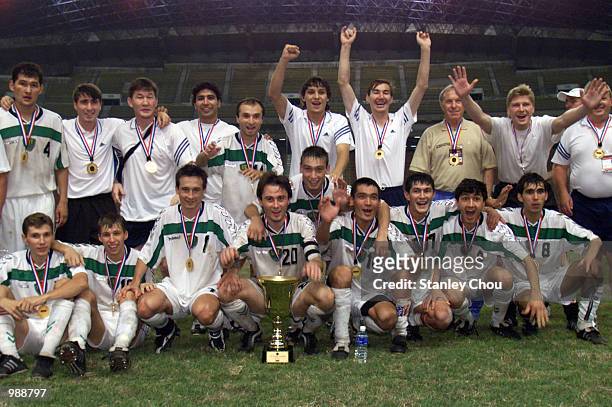 Uzbekistan celebrates with the Merdeka Trophy after they defeated Bosnia & Herzegovina 2-1 in a golden goal during extra time during the 37th Merdeka...