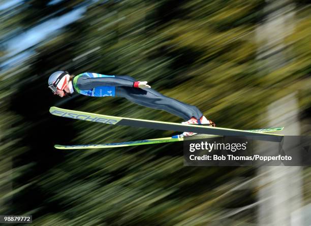 Gregor Schlierenzauer of Austria competes in the men's ski jumping team event on day 11 of the 2010 Vancouver Winter Olympics at Whistler Olympic...