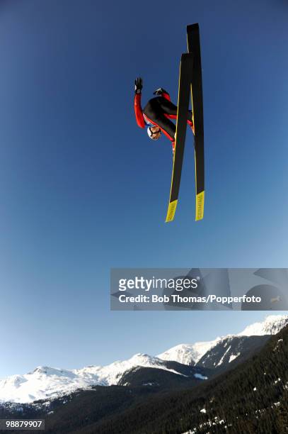 Competitor in the men's ski jumping team event on day 11 of the 2010 Vancouver Winter Olympics at Whistler Olympic Park Ski Jumping Stadium on...