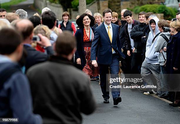 Liberal Democrat Leader Nick Clegg walks through a crowd on his way to casting his vote with wife Miriam Gonzalez Durantez at Bents Green Methodist...